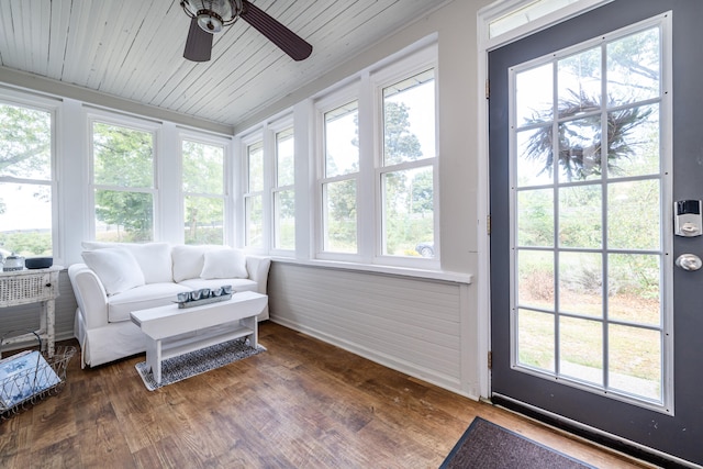 sunroom / solarium featuring ceiling fan