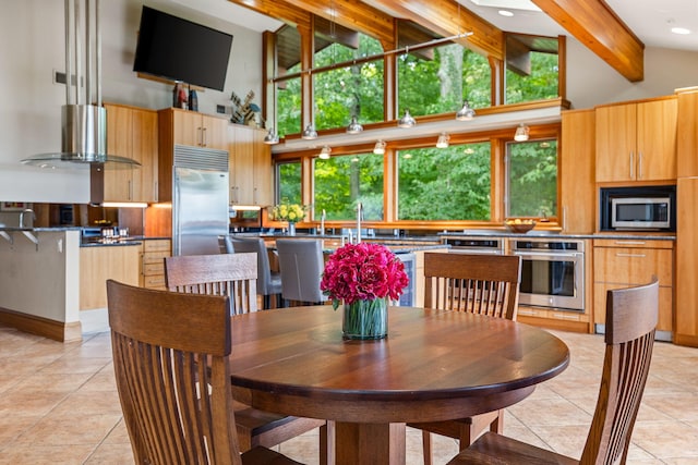 dining room with high vaulted ceiling, beam ceiling, and light tile patterned floors