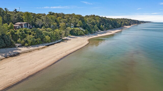 bird's eye view featuring a view of the beach and a water view