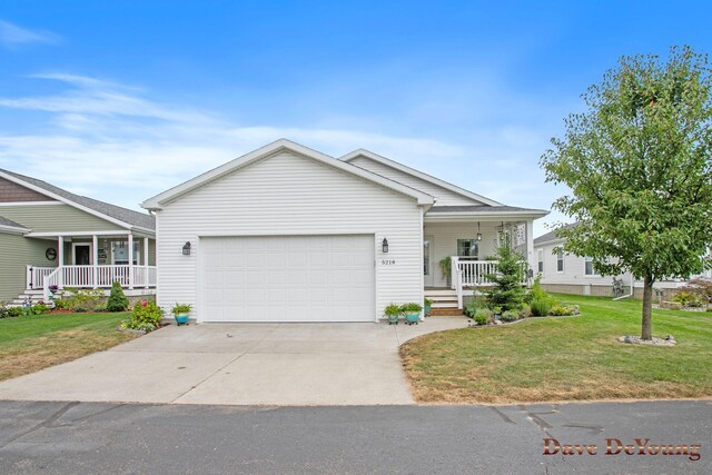 ranch-style house with a front yard, a porch, and a garage