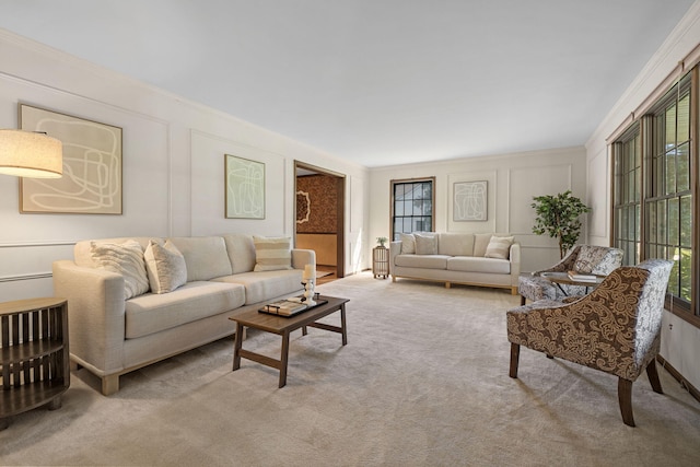 carpeted living room with ornamental molding