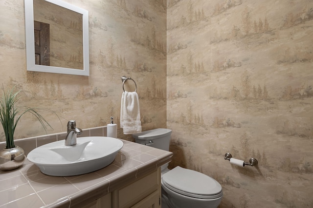 bathroom with vanity and toilet