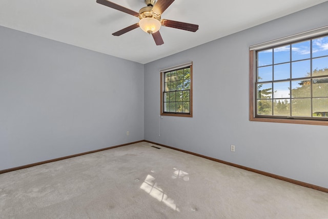 carpeted empty room with ceiling fan