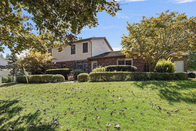 view of property featuring a front lawn