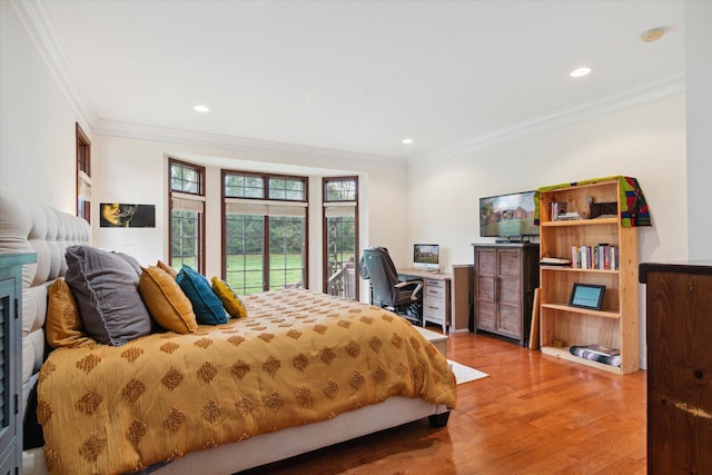 bedroom featuring access to exterior, hardwood / wood-style floors, and ornamental molding