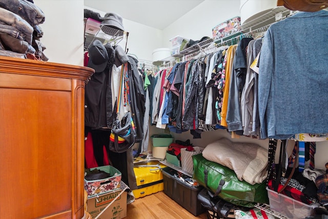 walk in closet featuring light hardwood / wood-style flooring