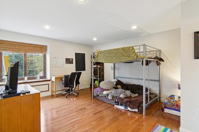 bedroom with hardwood / wood-style flooring