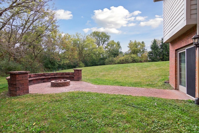 view of yard with a fire pit