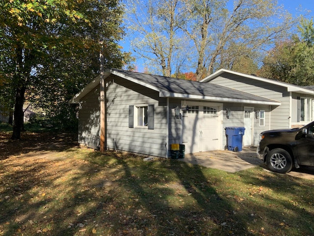 view of side of home featuring a garage