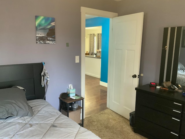 bedroom with hardwood / wood-style floors