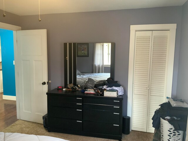 carpeted bedroom with a closet