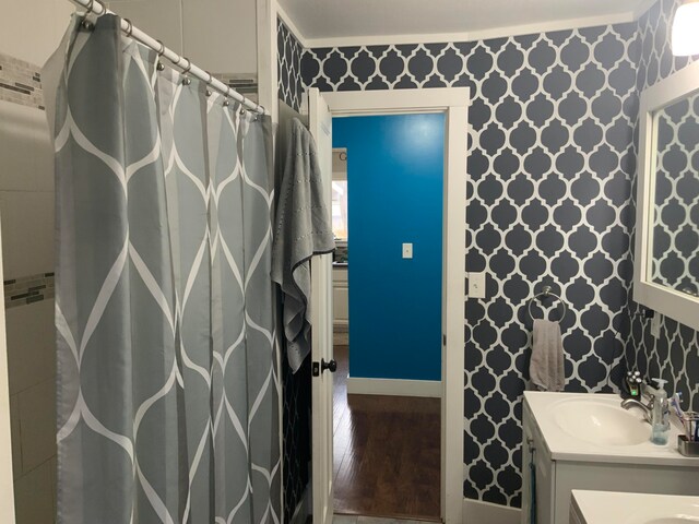 bathroom featuring vanity and hardwood / wood-style floors