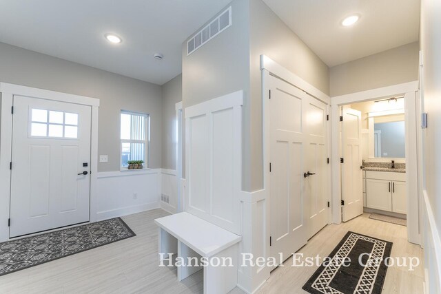 entrance foyer featuring light hardwood / wood-style floors and sink