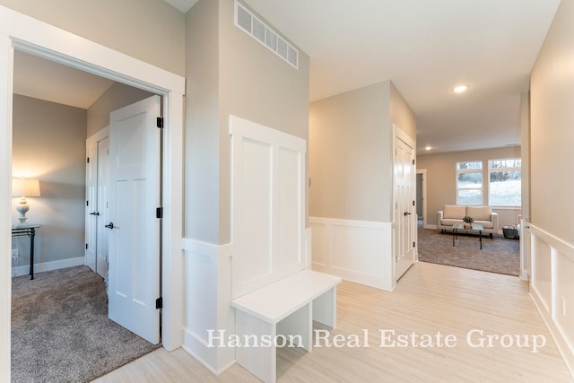 hall with light hardwood / wood-style floors