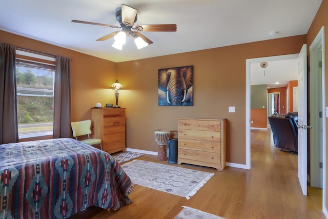 bedroom featuring ceiling fan and hardwood / wood-style floors