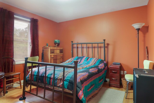 bedroom featuring wood-type flooring