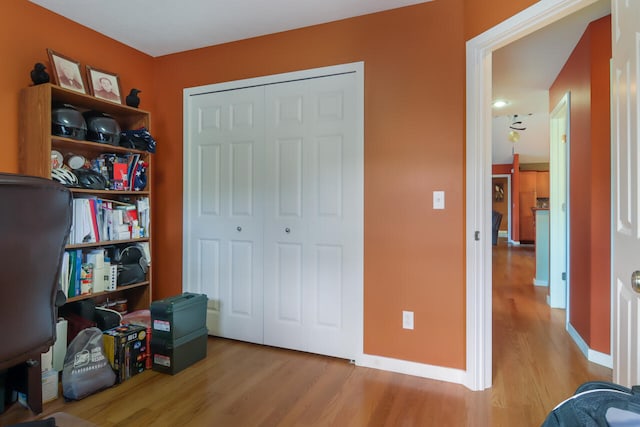 bedroom featuring a closet and light hardwood / wood-style flooring