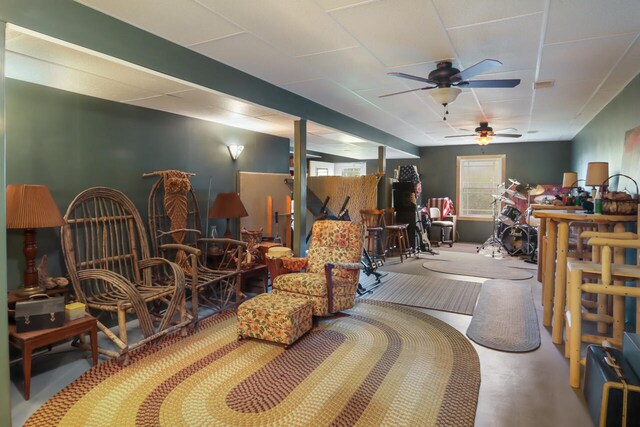 interior space with concrete flooring and ceiling fan