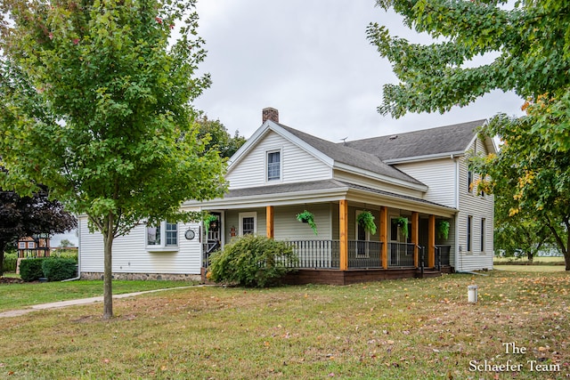 farmhouse with a porch and a front yard