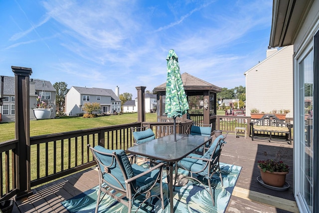 6650 Wing St, Ypsilanti, MI 48197 - wooden terrace with a gazebo, outdoor dining area, a residential view, and a lawn