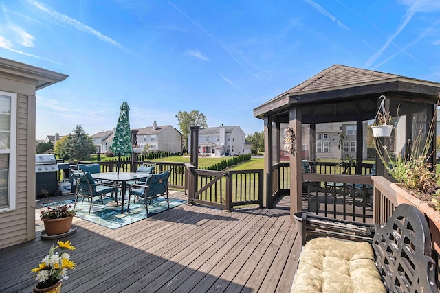 6650 Wing St, Ypsilanti, MI 48197 - wooden terrace with a gazebo, grilling area, a residential view, a lawn, and outdoor dining area