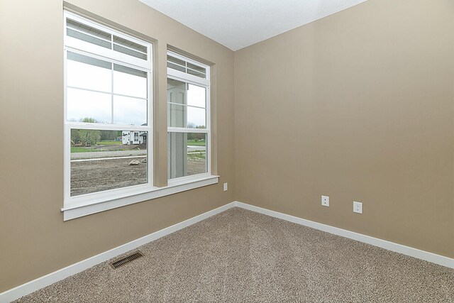 empty room with carpet flooring