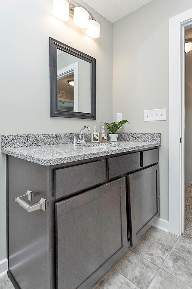 bathroom with vanity and tile patterned floors