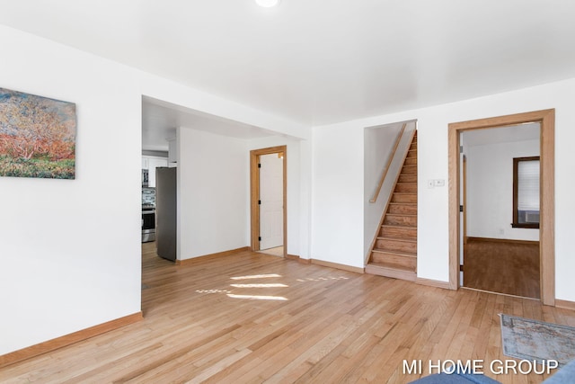 empty room with light hardwood / wood-style flooring