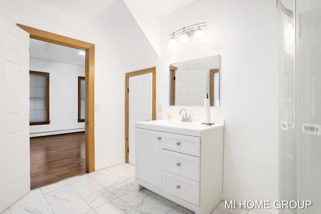 bathroom with baseboard heating and vanity