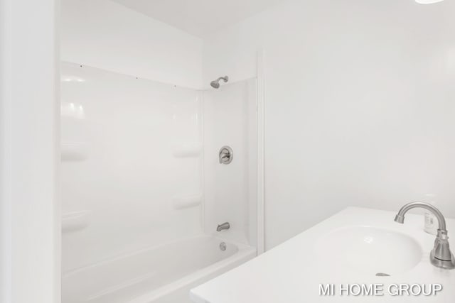 bathroom with shower / bathtub combination and sink