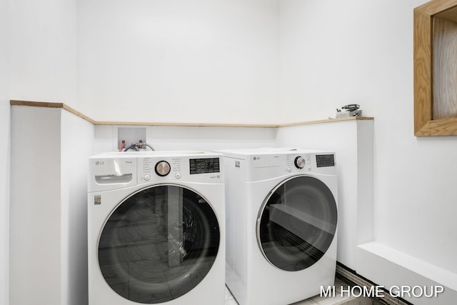 laundry area with washing machine and dryer