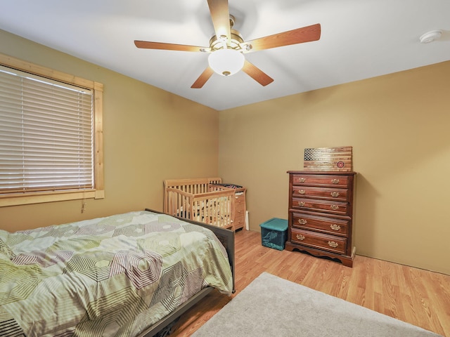 bedroom featuring hardwood / wood-style flooring and ceiling fan