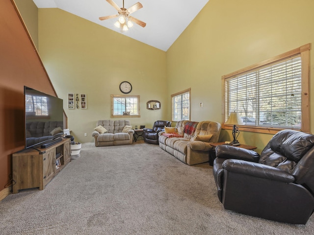 carpeted living room with high vaulted ceiling and ceiling fan