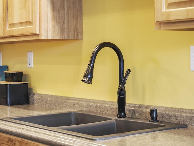 room details featuring sink and light brown cabinets