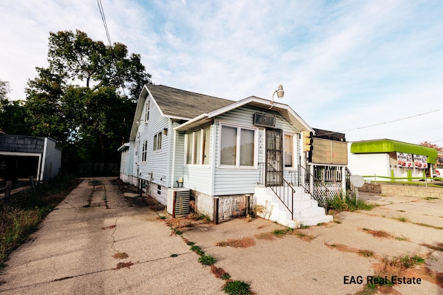 view of front of property with cooling unit