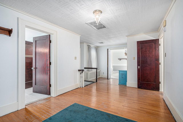 spare room featuring light hardwood / wood-style floors