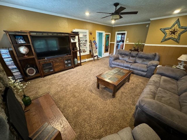 living room featuring carpet floors, baseboard heating, ornamental molding, a textured ceiling, and ceiling fan