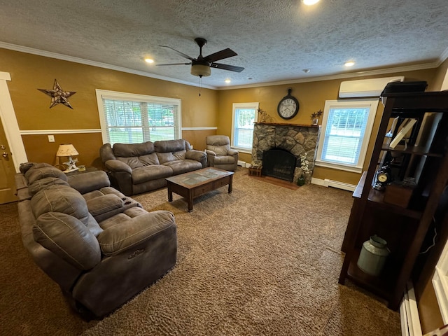 living room featuring carpet, ceiling fan, a textured ceiling, ornamental molding, and a fireplace