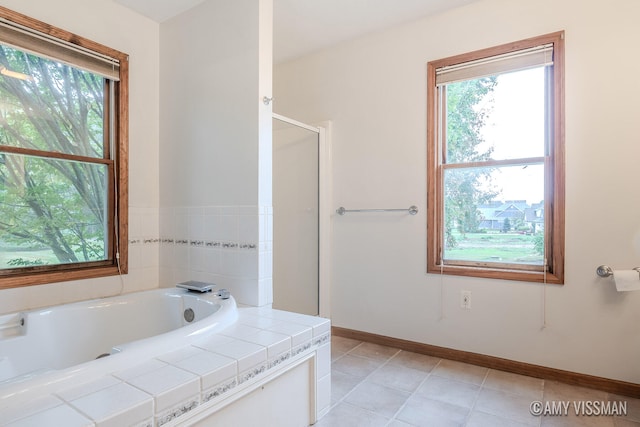 bathroom featuring shower with separate bathtub and tile patterned floors