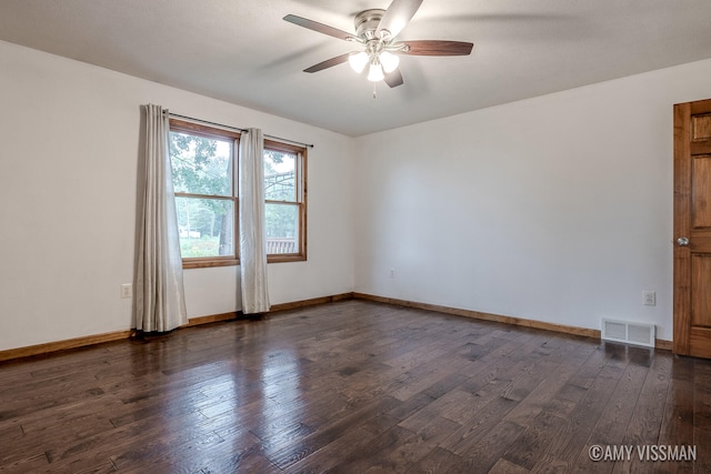 unfurnished room featuring ceiling fan and dark hardwood / wood-style floors