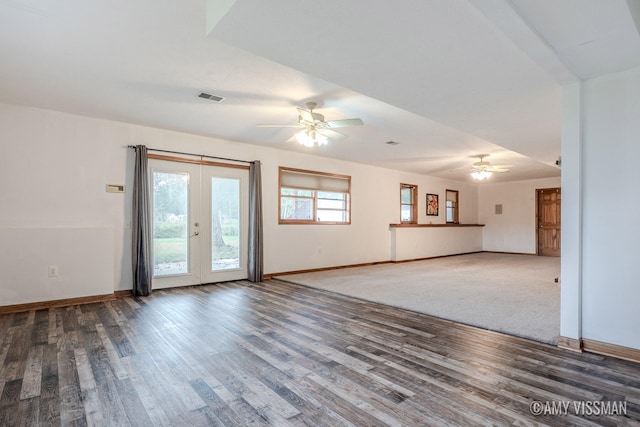 unfurnished living room featuring ceiling fan, french doors, and hardwood / wood-style floors