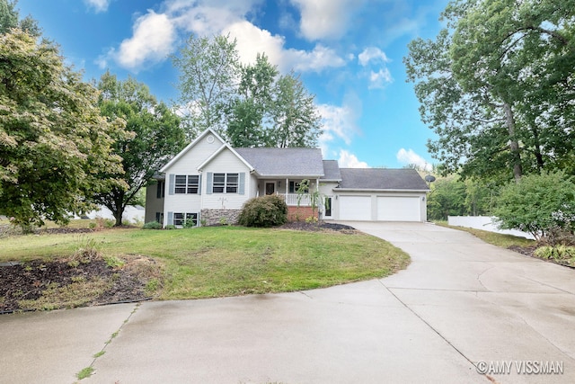 view of front of home featuring a garage and a front lawn