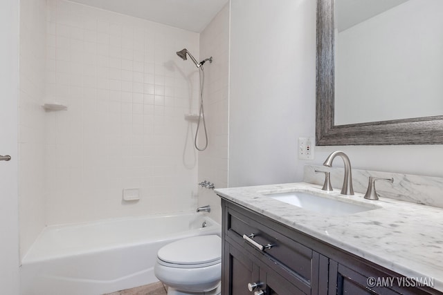 full bathroom with vanity, toilet, and tiled shower / bath