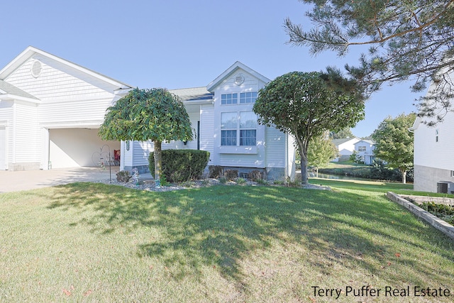 view of front of property featuring a front yard and central AC unit