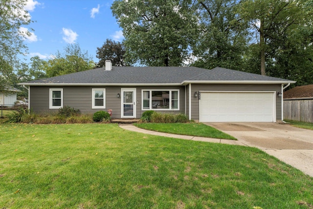 ranch-style home featuring a garage and a front lawn