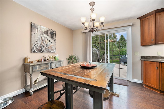 dining space featuring a chandelier and dark wood-type flooring