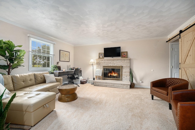 living room featuring a brick fireplace, ornamental molding, carpet flooring, and a barn door