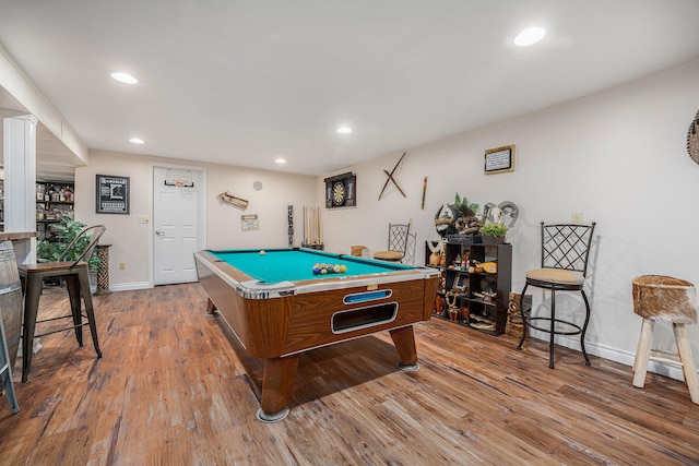 rec room with light hardwood / wood-style floors and billiards