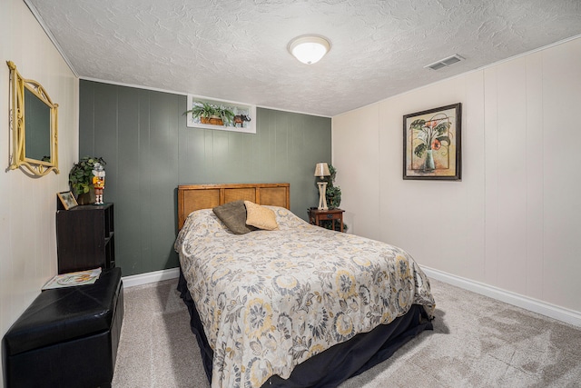 bedroom with a textured ceiling and carpet