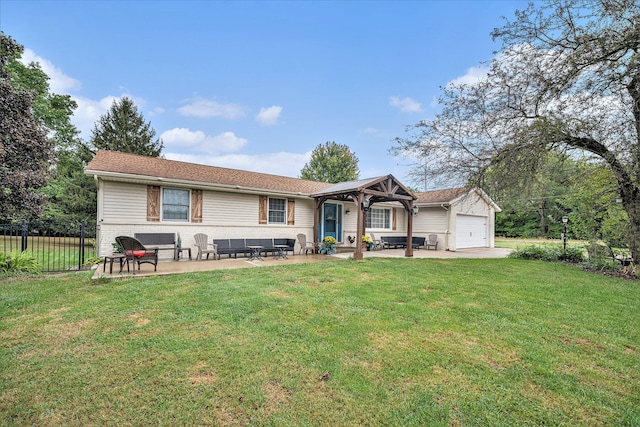 exterior space with a front yard, a garage, and a patio